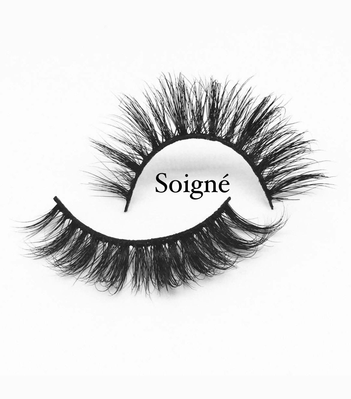 A pair of thick, black false eyelashes is arranged on a white background. The brand name "Nayy Seduction Brand" is positioned across the top eyelash in elegant black lettering. These MesmerEyes Mink Lashes boast a dramatic, wispy design guaranteed to make your eyes pop.